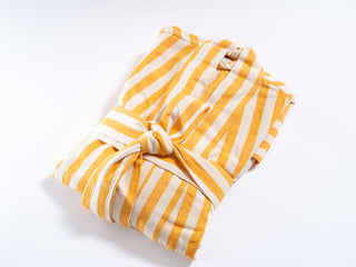Artisan crafted yellow and white striped robe with hand finished details