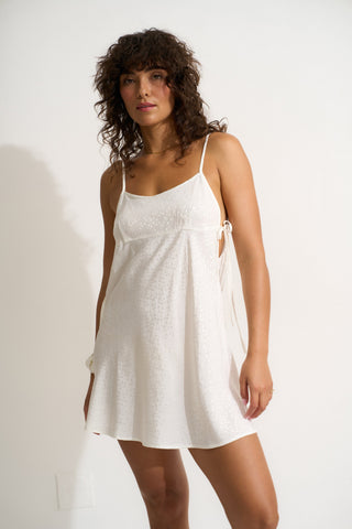 Woman wearing a short white nightgown