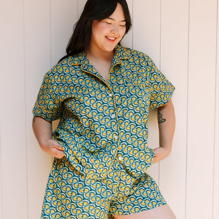 Woman wearing marigold pattern short pajama set