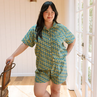 Woman wearing blue and yellow marigold short sleepwear set