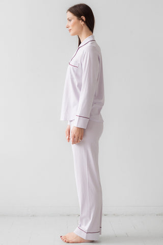 Side profile of woman wearing luxury sleep set from Salua Lingerie