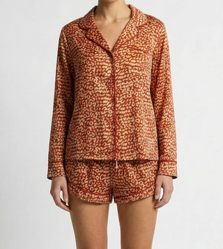 Woman wearing cute matching red leopard pajama set