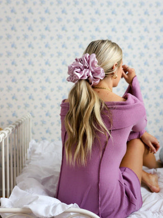 Girl with blonde ponytail wearing a lavender silk scrunchie
