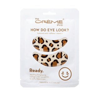 Leopard print under eye patches in a white 'The Crème Shop' packaging on a white background