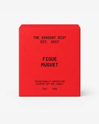 Red candle box with black text "FIGUE MUGUET" on a white background