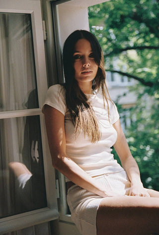 Woman wearing white organic cotton tee