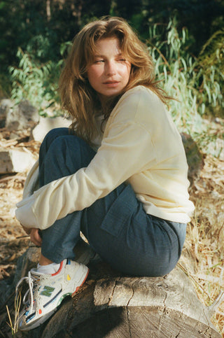 Woman wearing comfortable yellow sweatshirt