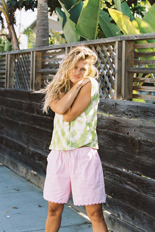 Woman wearing pink cotton poplin shorts in the summer
