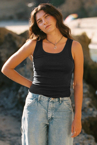 Woman wearing black breathable cotton tank top