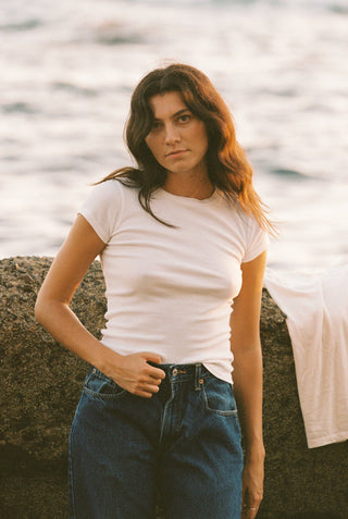 Woman wearing white cotton tee
