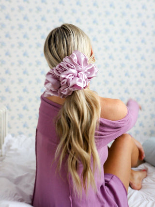 Girl with blonde ponytail wearing a lavender silk scrunchie