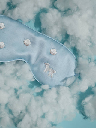 Lost Pattern sky blue silk poodle and cloud eye mask showing smooth mulberry silk texture