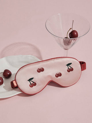 Pink silk sleep mask with cherry detail
