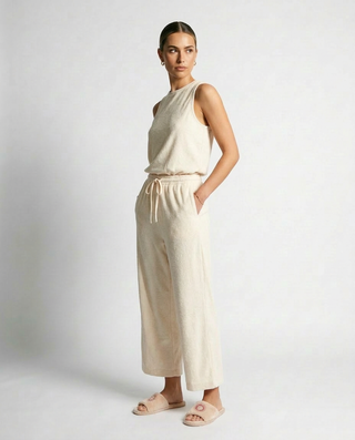 Beige sleeveless summer jumpsuit with cropped bottoms