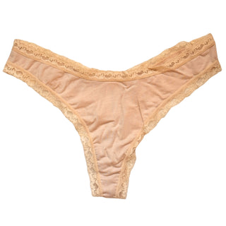 Beige lace thong on a white background