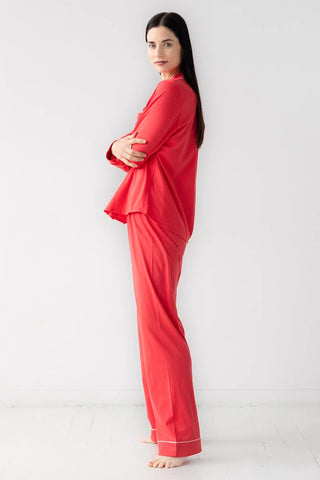 Side profile of woman wearing red pima cotton pajama set