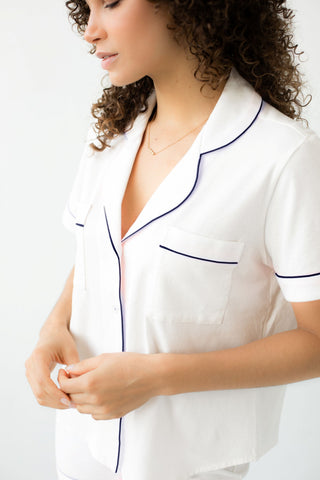 Woman wearing soft white short pajama set