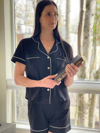 Woman wearing soft short sleepwear set in black
