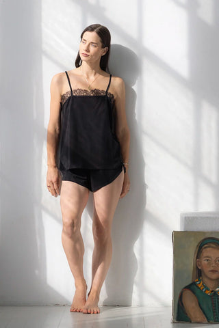 Women wearing Salua Lingerie black pima cotton cami and shorts pajama set