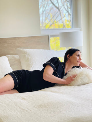 Woman wearing Salua Lingerie luxury short pajama set in black