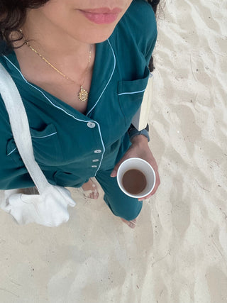 Women wearing cozy teal pajama set at the beach