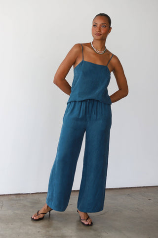 Relaxed fit teal lounge pants shown with matching tank top
