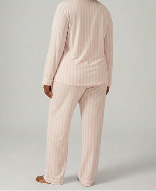 Woman wearing Stripe and Stare pink and white stripe sleepwear set