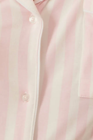 Close up of pink & white stripe button-up pajama top